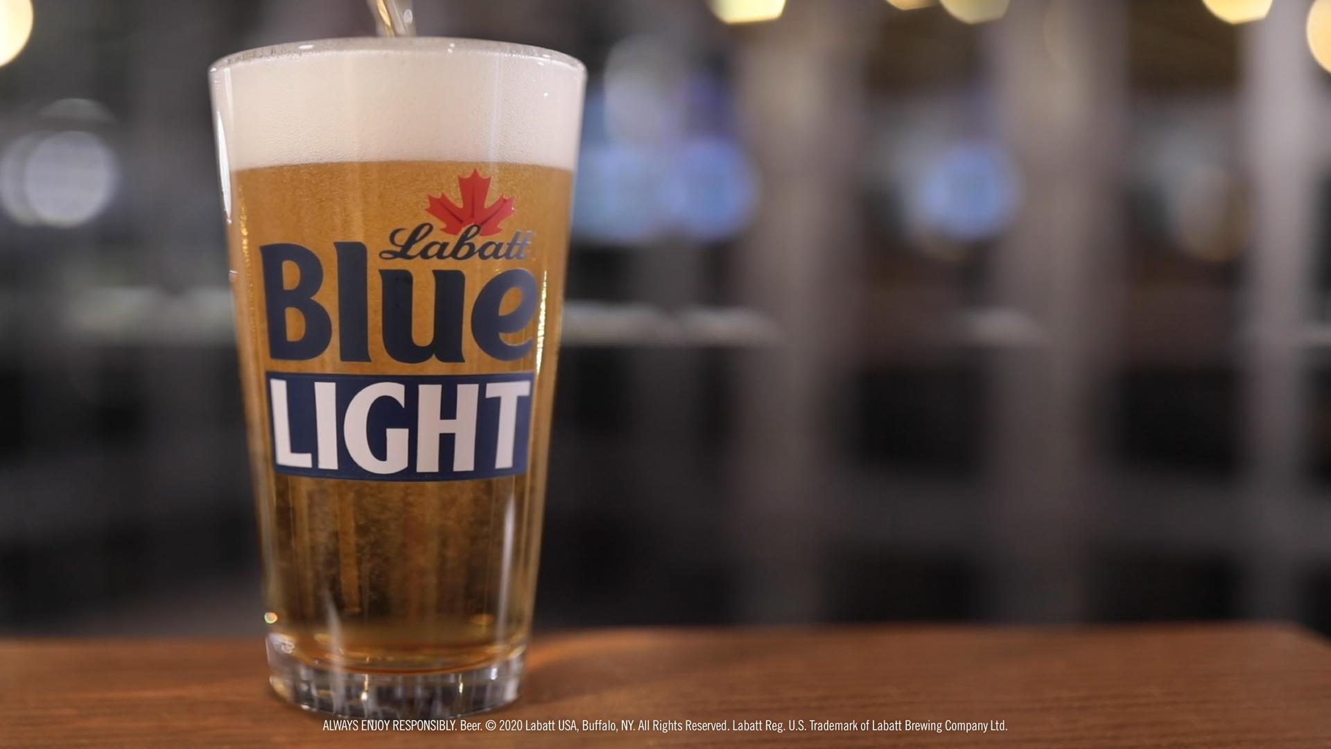Blue Light Pint Glass on a Bar Background